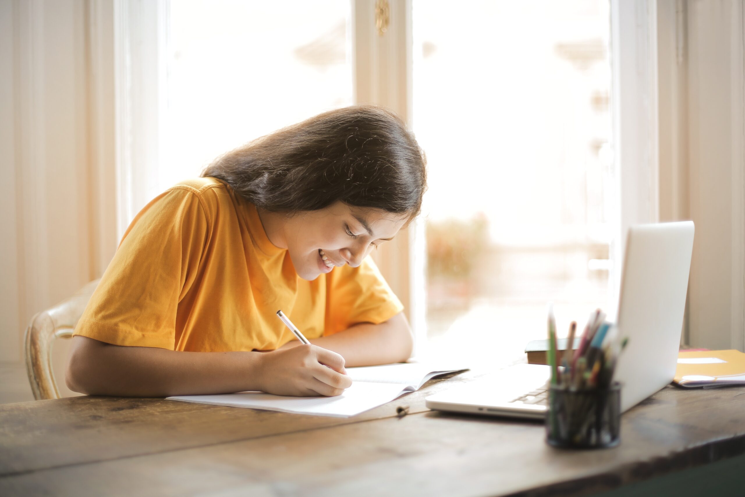 A person writing on paper