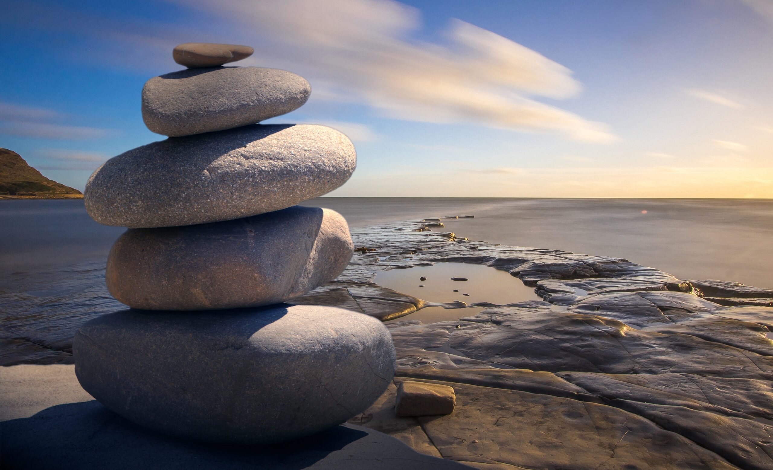 Stack of smooth rocks on a beach